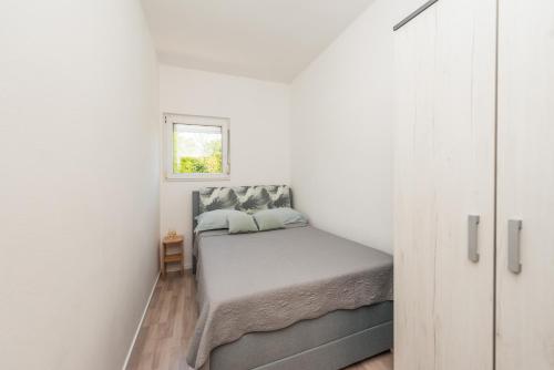 Postel nebo postele na pokoji v ubytování Nelly Apartments