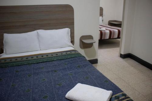 Postel nebo postele na pokoji v ubytování Hotel Winn Comfort