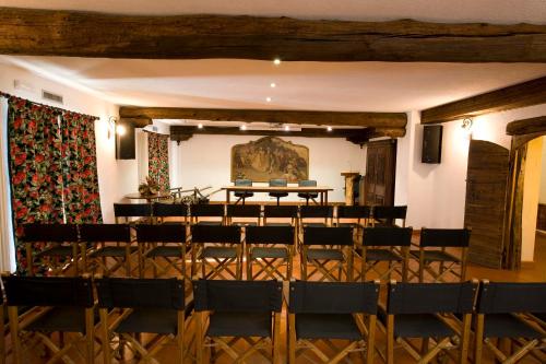 a room with a stage and chairs in it at Hotel Milleluci in Aosta
