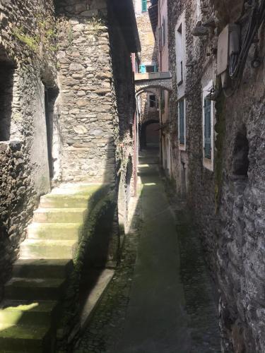 an alley way between two stone buildings at C’era una Volta in Isolabona