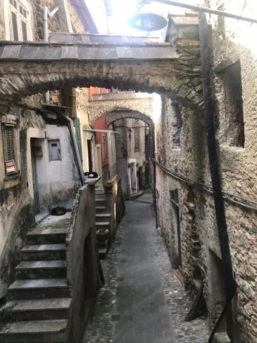 an alley with stairs in an old building at C’era una Volta in Isolabona