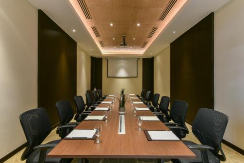 a large conference room with a long table and chairs at Seda Lio in El Nido