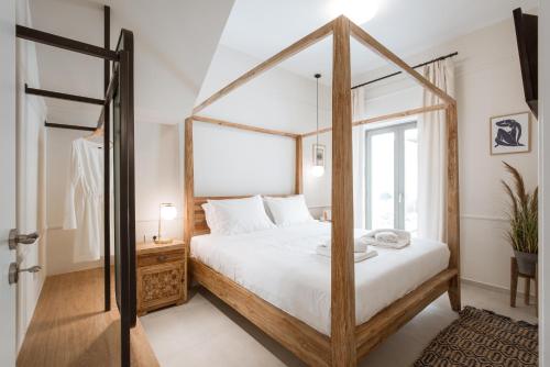 a bedroom with a large bed and a mirror at Casa Dei Miracoli in Chania Town