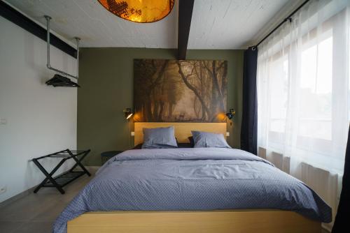 Een bed of bedden in een kamer bij Appartement Les Bleuets