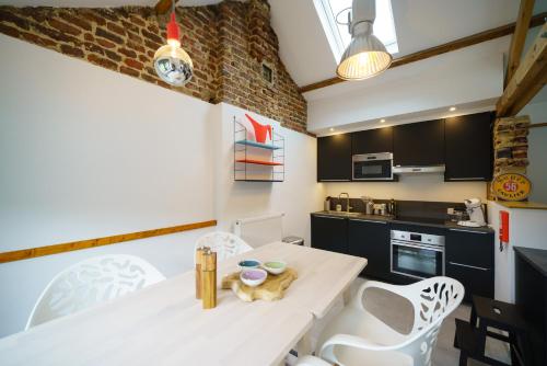 Kuchyň nebo kuchyňský kout v ubytování Appartement Les Bleuets