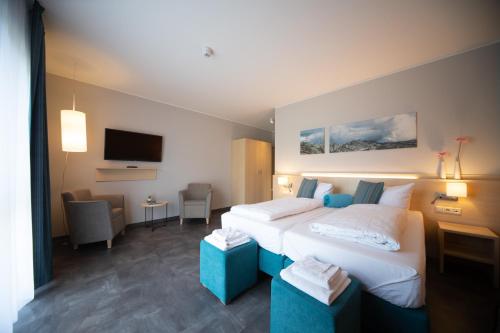 Een bed of bedden in een kamer bij Riff Resort