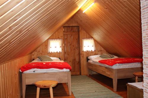 A bed or beds in a room at Schmiedalm