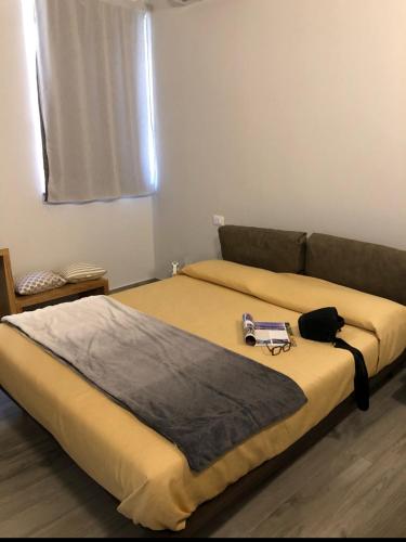 a bedroom with a bed with a tray on it at Le Suite in Polistena