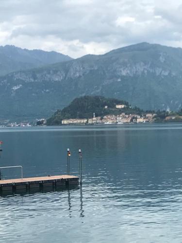 a dock in the middle of a large body of water at Casa Ivana in Menaggio