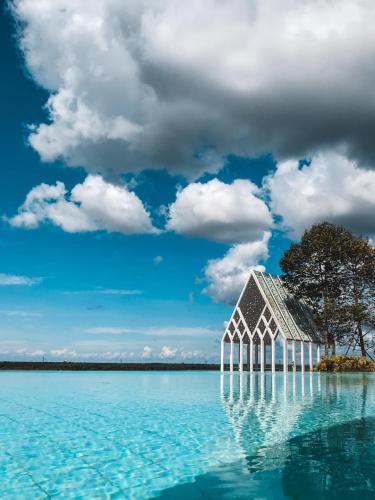 a building in the middle of a body of water at UCSI Hotel Kuching in Kuching