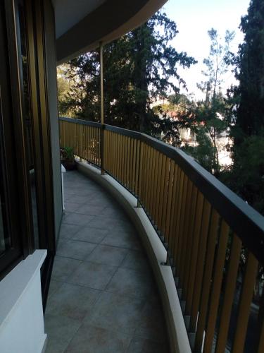 a balcony with a wooden railing on a house at 3 Bedroom Apartment in Nicosia