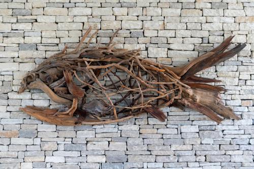 a pile of branches on a brick wall at Acanthus Cennet Barut Collection - Ultra All Inclusive in Side