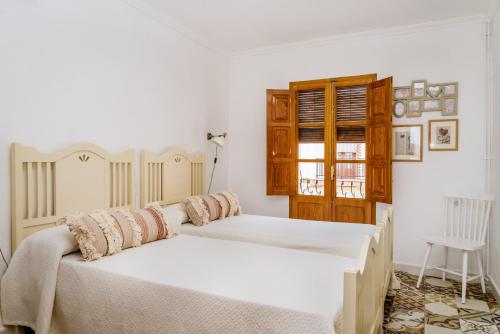 Giường trong phòng chung tại Casa rural la ermita de Anna