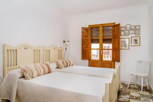 Posteľ alebo postele v izbe v ubytovaní Casa rural la ermita de Anna