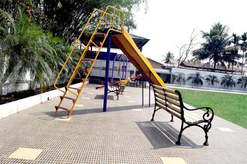 a park with a playground with a slide at The Cindrella Hotel in Siliguri