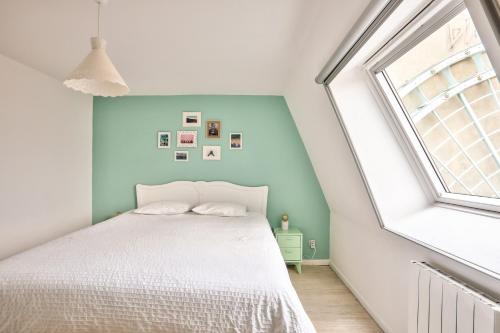 Una cama o camas en una habitación de Appart' Grand'Place