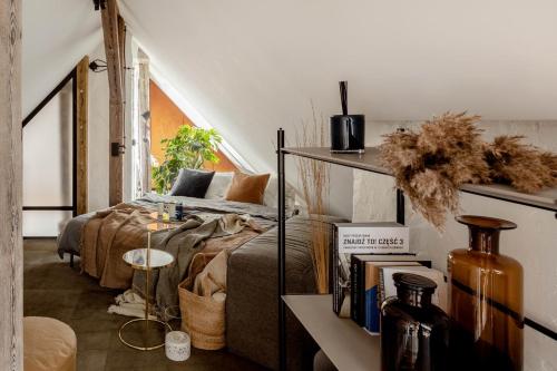a living room with a couch and a bed at Mystictone - loft in the heart of Warsaw - Nowy Świat ROOMTONES in Warsaw