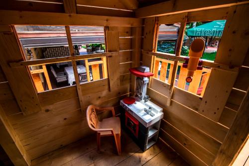 an inside view of a cabin with two windows at Hotel Golden House in Craiova