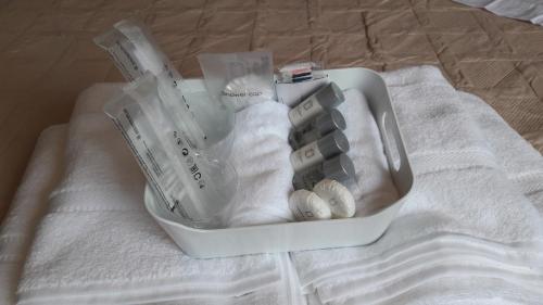 a plastic container filled with items on a bed at CASA MENCIA in Sober