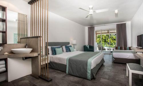 Letto o letti in una camera di La Mariposa Mauritius