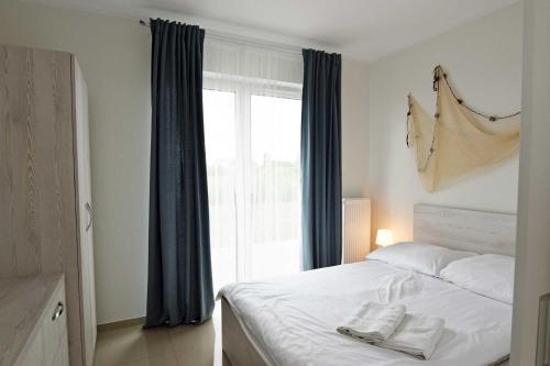 Ein Bett oder Betten in einem Zimmer der Unterkunft Apartamenty Tropicana
