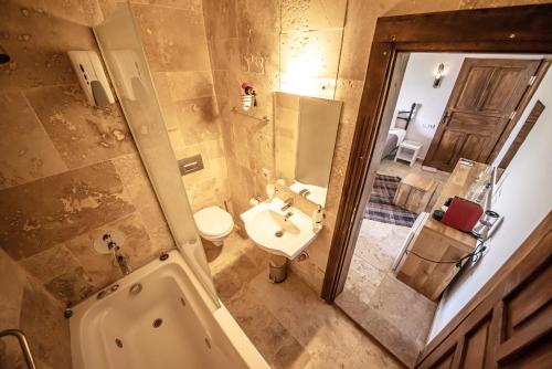 a bathroom with a toilet and a sink and a shower at Murat Pasha Mansion in Dalyan