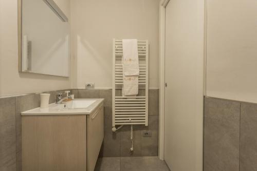 a bathroom with a sink and a mirror at Film Studios in Milan