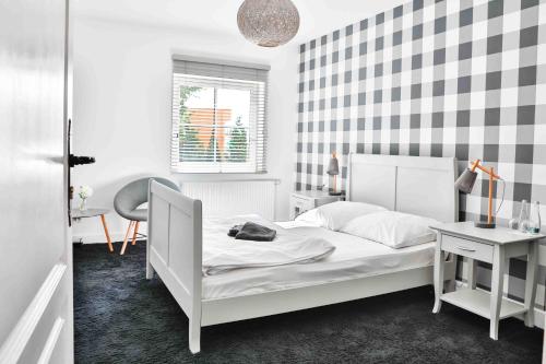 Postel nebo postele na pokoji v ubytování Hotel Portus