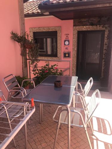 a blue table and chairs on a patio at Casa da Avo in Geres