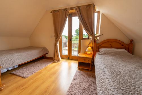 מיטה או מיטות בחדר ב-The Drey - Ash Farm Cotswolds