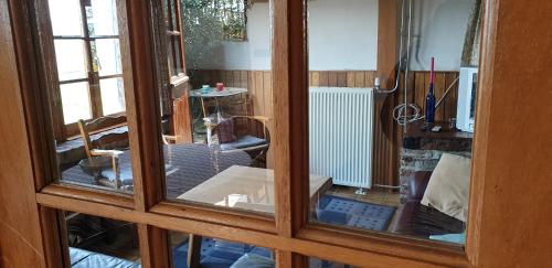 a view of a living room through a glass door at Oud-Bommerich in Mechelen