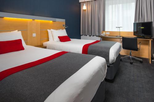 เตียงในห้องที่ Holiday Inn Express Cambridge, an IHG Hotel