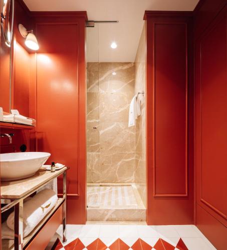 a bathroom with a shower and a sink at Bairro Alto Hotel in Lisbon