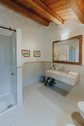 a bathroom with a sink and a mirror at Alle Pendici del Conero in Sirolo