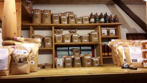 a store with lots of bags and bottles on a shelf at Karensdal B & B in Uldum