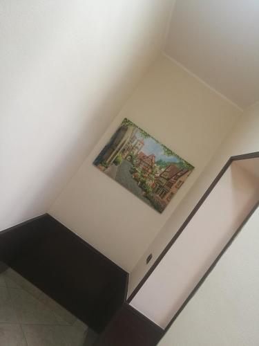 a painting on the ceiling of a room at Garden Inn in Capua
