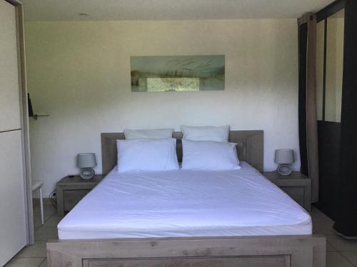 A bed or beds in a room at VILLA ROMAGA