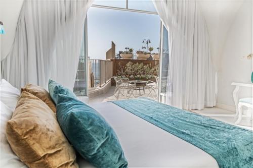 Casa Nova - Luxury Suites & Boutique Apart-Hotelにあるベッド