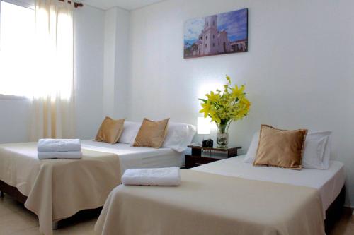 Postel nebo postele na pokoji v ubytování Hotel Tucuraca by DOT Tradition