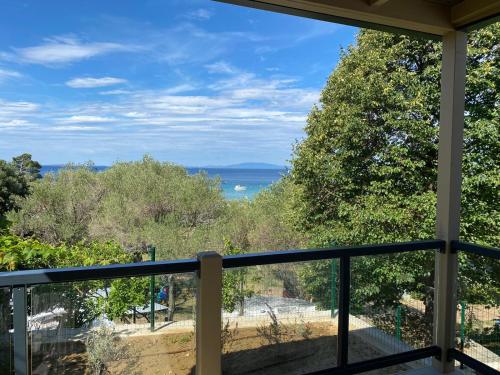 a balcony with a view of the ocean at Victoria Mobilehome in Padova Premium Camping Resort in Banjol