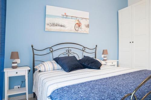 A bed or beds in a room at La casa nel borgo