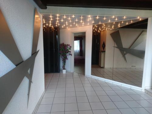 a hallway with christmas lights and a tile floor at Fachwerkhaus in D 63667 Nidda für 8 bis 12 Personen in Nidda