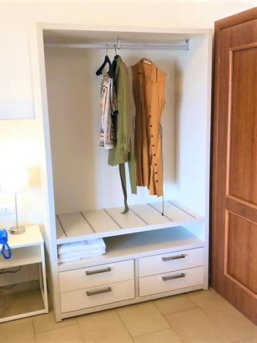 a walk in closet with a dresser with a dresser at Hotel Villa Eleonora in Scauri