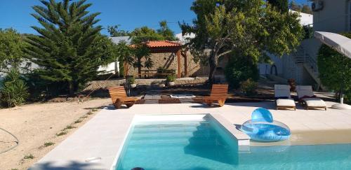 a swimming pool with a blue dolphin in a yard at FIND Your Space Casa no Campo - Paderne - Albufeira - Piscina Privada - Aquecida a pedido in Paderne