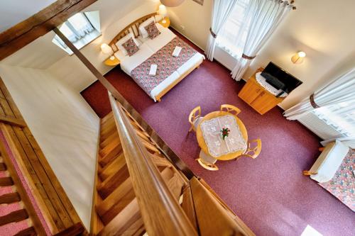 an overhead view of a room with a bed and a table at Penzion Onyx in Český Krumlov