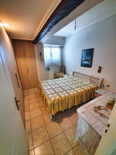 a bedroom with two beds in a room at Manolis House in Lefkada