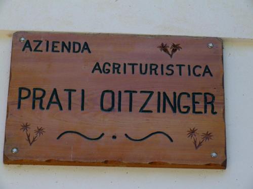 a sign on a wall that readsfifth offzinger at Agriturismo Prati Oitzinger in Valbruna