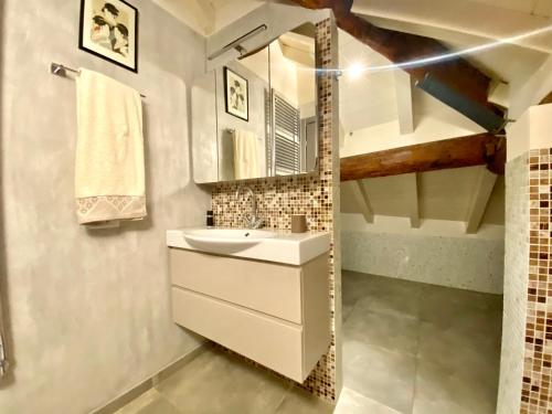 a bathroom with a sink and a mirror at ABCdecor Italia in Imperia