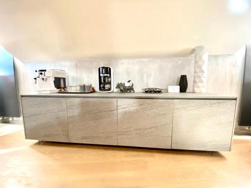 a kitchen with a stainless steel counter top in a room at ABCdecor Italia in Imperia