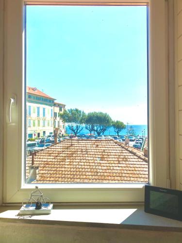 a window with a view of a brick wall at ABCdecor Italia in Imperia